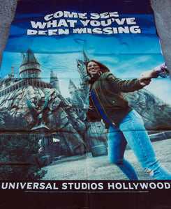 A billboard advertisement for The Wizarding World of Harry Potter at Universal Studios Hollywood.