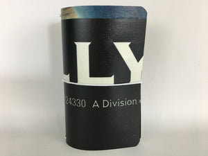 Passport size travelers notebook cover featuring white typography on a black background from a billboard advertising The Wizarding World of Harry Potter at Universal Studios Hollywood.