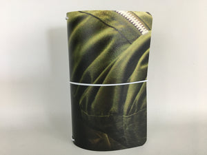 Field Note size refillable notebook cover with an olive green image from recycled vinyl billboard.