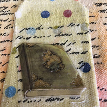Scrapbook paper transferred to fabric with a 7gypsies embellishment