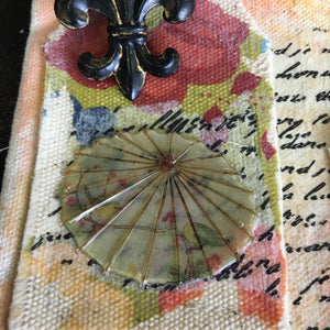 Decorative paper transferred to canvas with an Asian umbrella Architextures trinket.