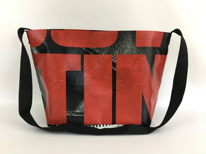 Vinyl tote bag with red typography from a Walking Dead billboard.