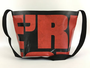 Vinyl tote bag with red typography from a Walking Dead billboard.