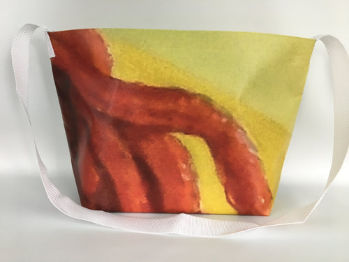 Vinyl tote bag with red, yellow and blue abstract patterns from a Trippie Redd billboard.